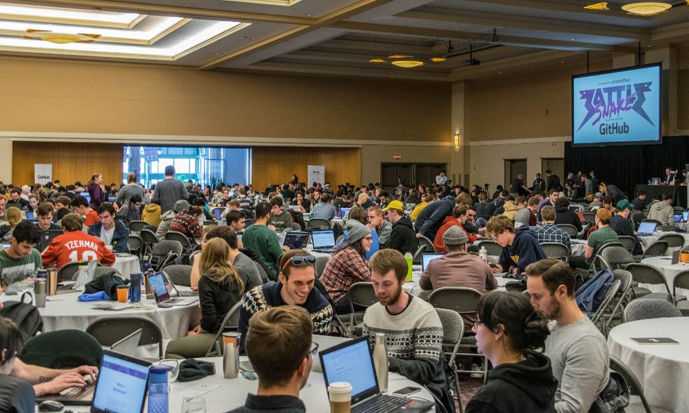 Conference room full of people working on their laptops during the event